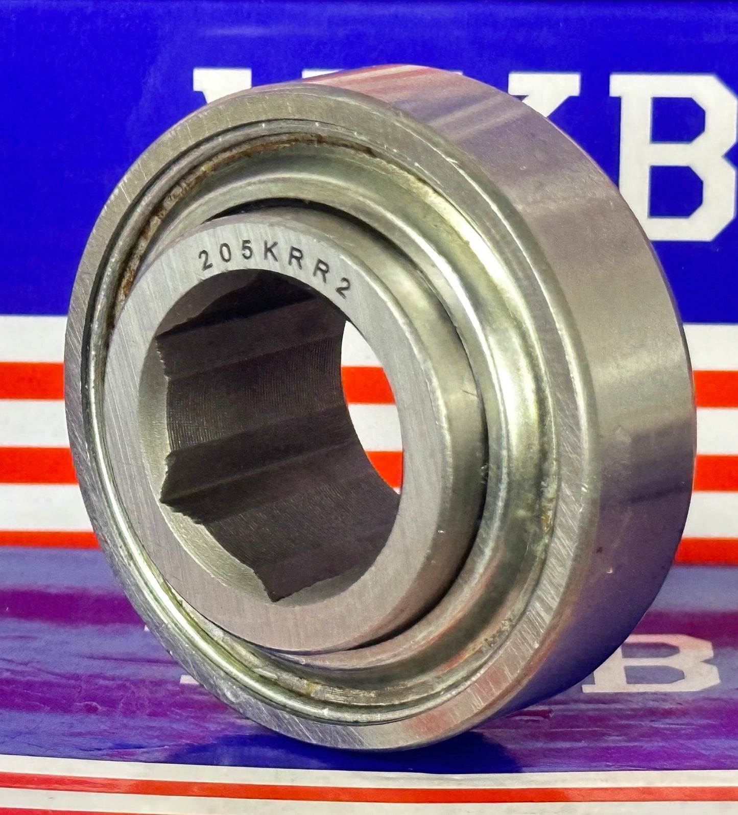 205KRR2 Agricultural Machinery bearing with Two Single lip Seals and Hex bore and Cylindrical OD