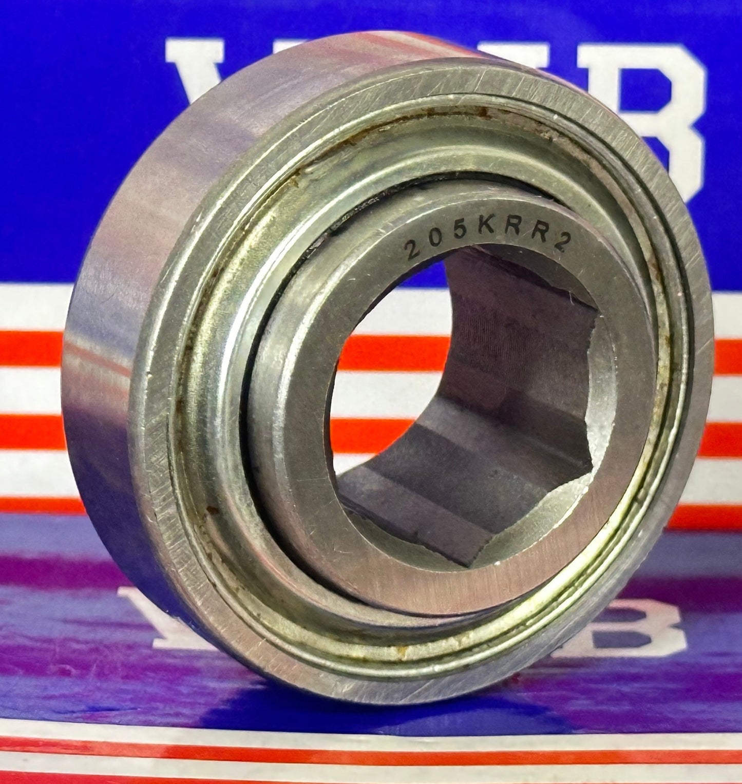 205KRR2 Agricultural Machinery bearing with Two Single lip Seals and Hex bore and Cylindrical OD