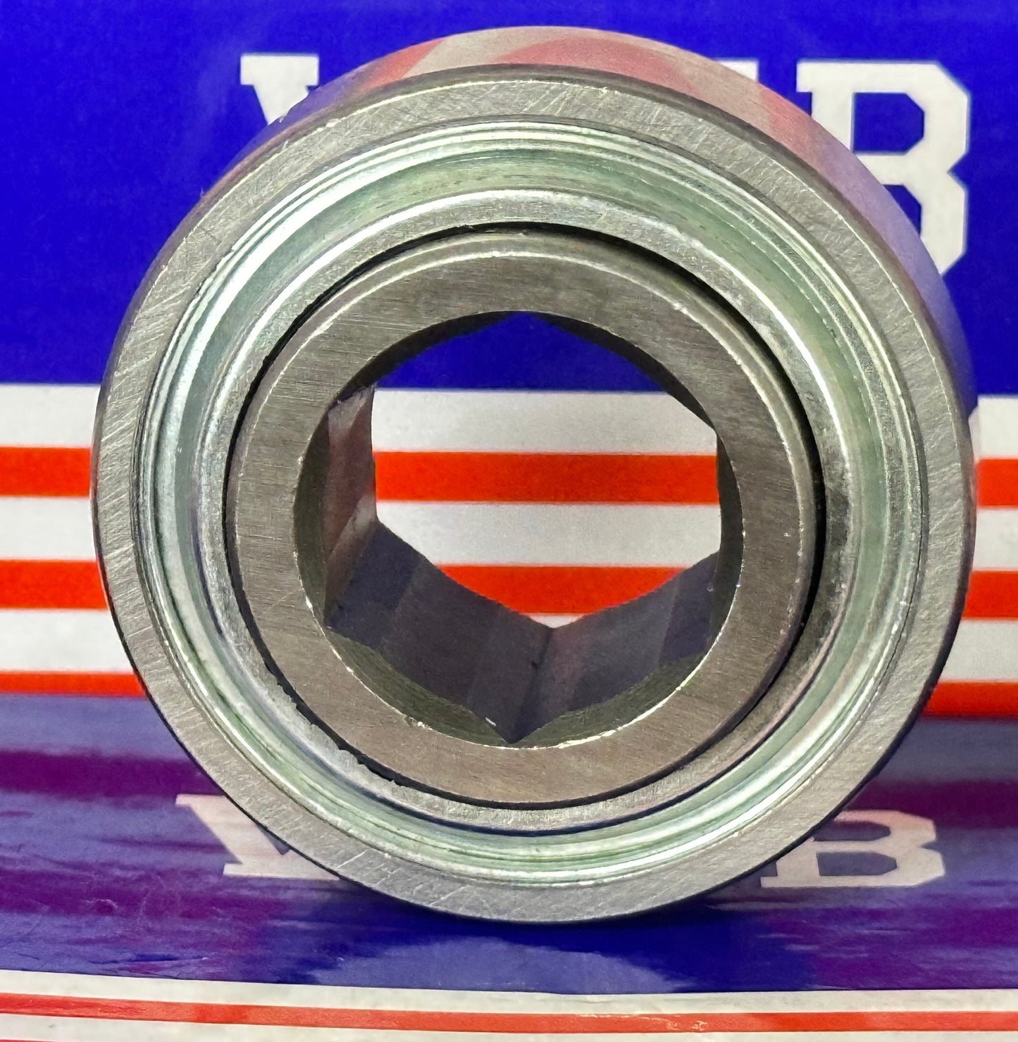 205KRR2 Agricultural Machinery bearing with Two Single lip Seals and Hex bore and Cylindrical OD